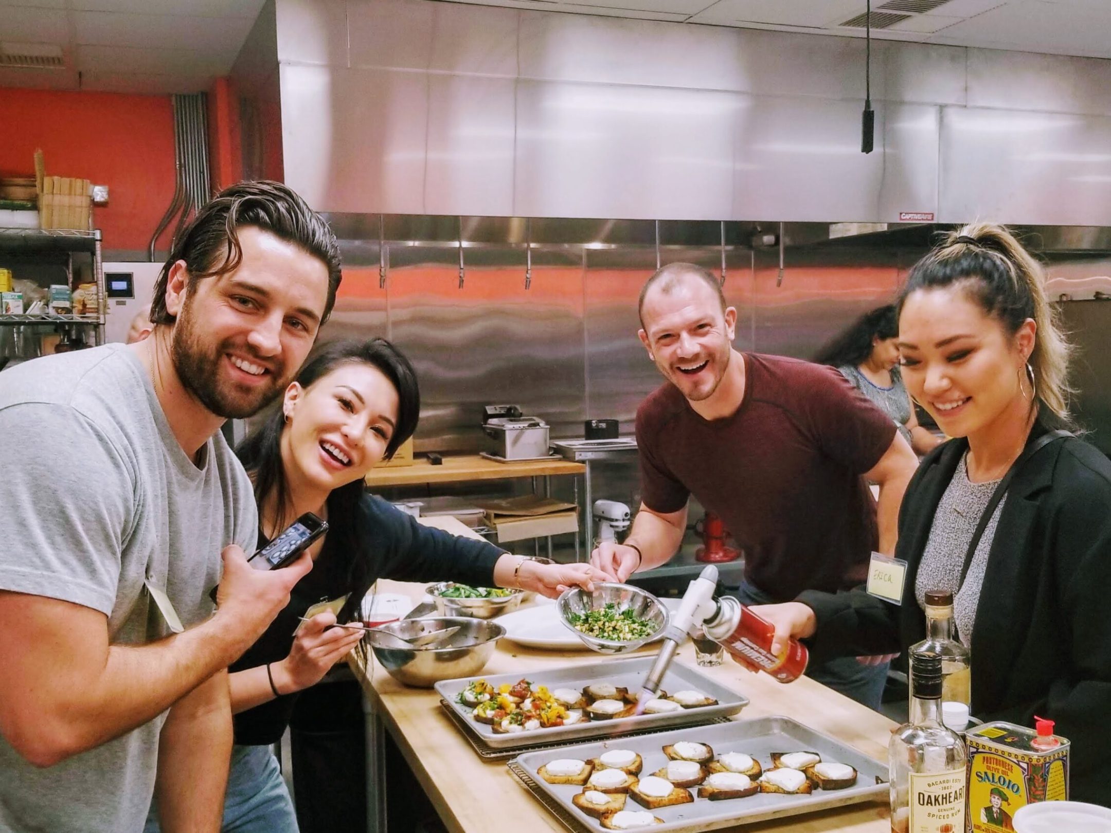 a group of people standing around a table